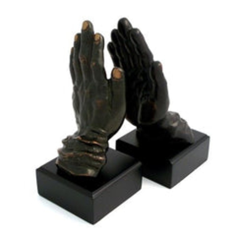 Cast Metal Hands Bookends With Bronzed Finish On Black Wood
